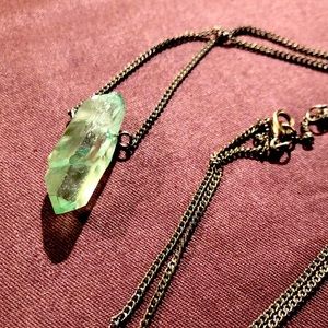 Raw Aquamarine stone necklace on silver chain.